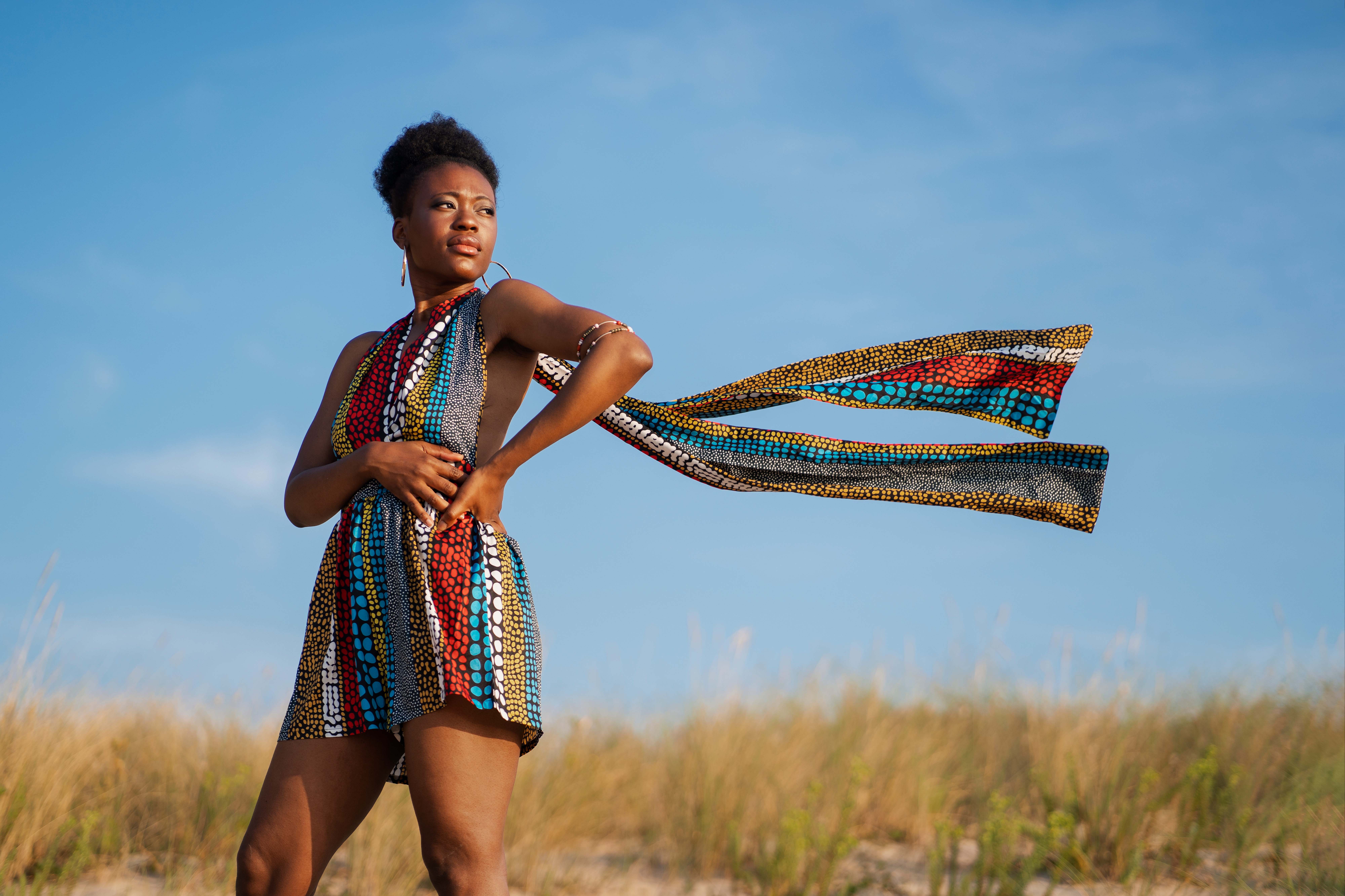 woman-posing-arid-environment-while-wearing-native-african-clothing